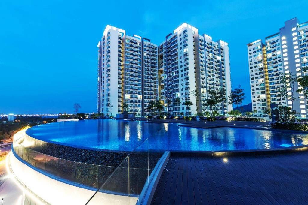 a large pool in front of some tall buildings at ●T11●2Pax●Studio●5min●Queensbay●Pg Bridge View● in Bayan Lepas