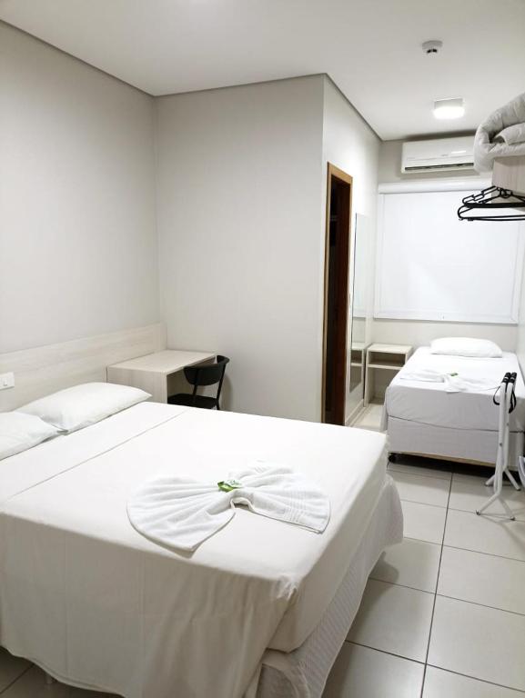 Postel nebo postele na pokoji v ubytování MFG Hotel