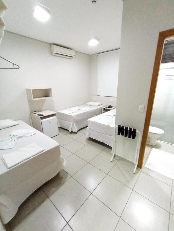 Postel nebo postele na pokoji v ubytování MFG Hotel