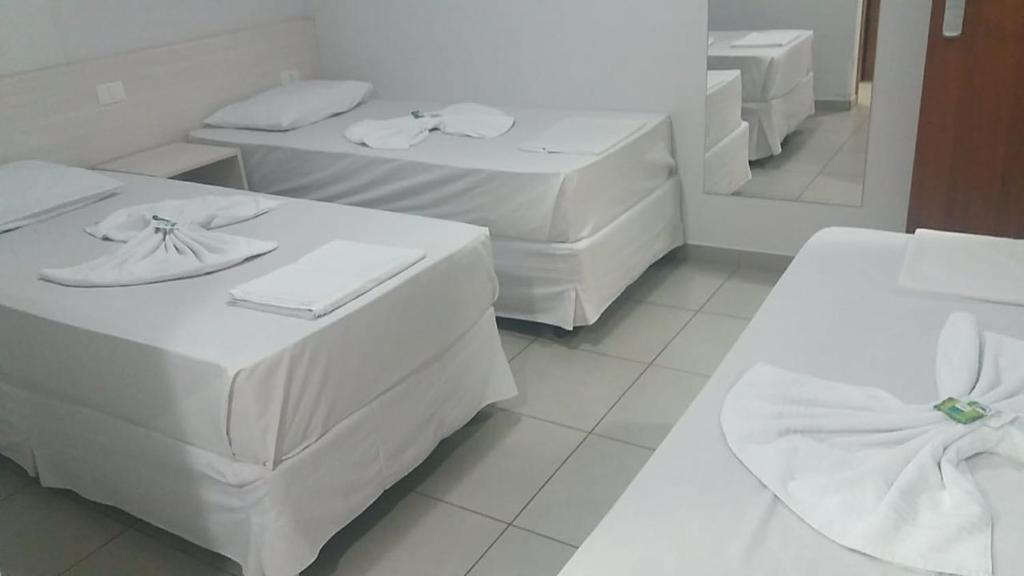 Postel nebo postele na pokoji v ubytování MFG Hotel