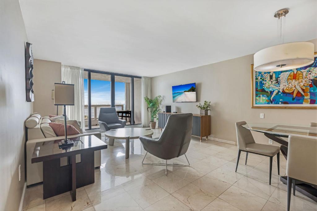 a living room with a table and chairs at High Rise Comfort with Balcony in Miami