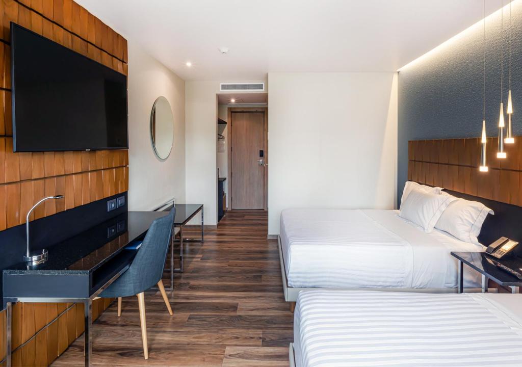 TV a/nebo společenská místnost v ubytování Hotel Real del Rio