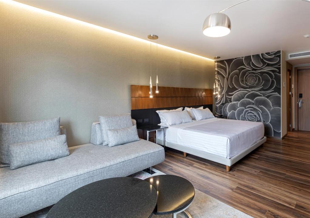 Postel nebo postele na pokoji v ubytování Hotel Real del Rio