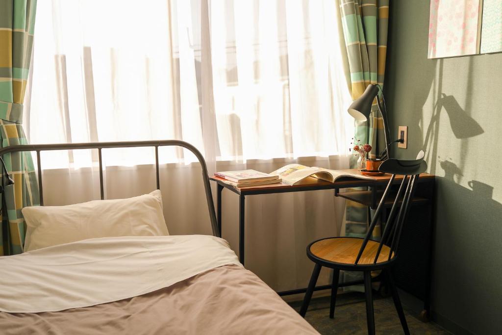 Postel nebo postele na pokoji v ubytování Hostel Niniroom
