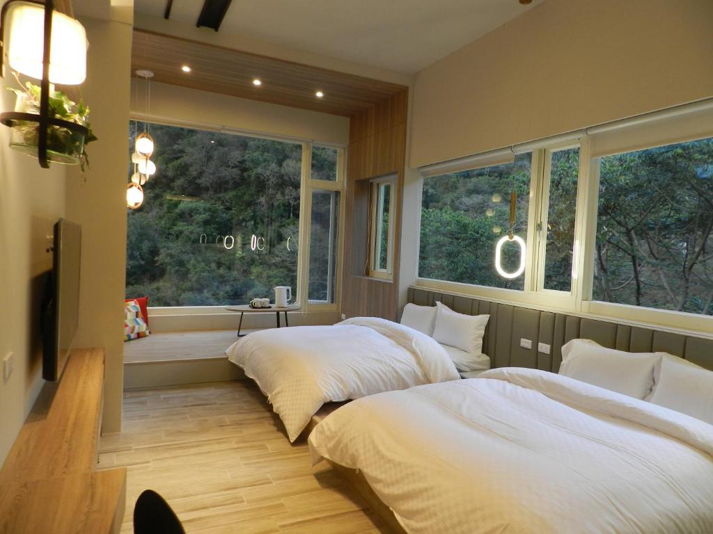 Postel nebo postele na pokoji v ubytování 谷關明高溫泉 Mingao Hot Spring Resort