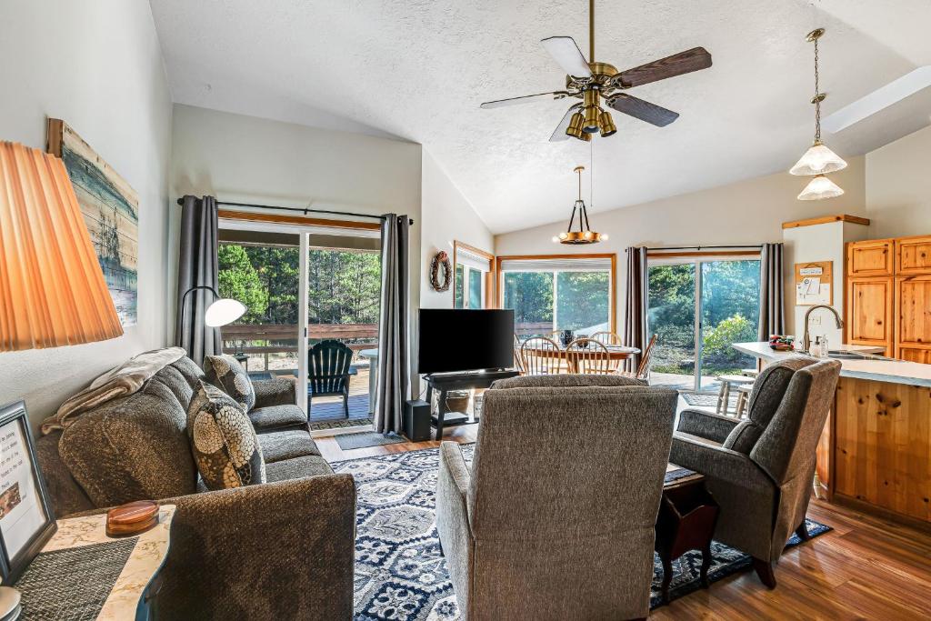 a living room with a couch and chairs and a table at Three Capes Cottage in Pacific City