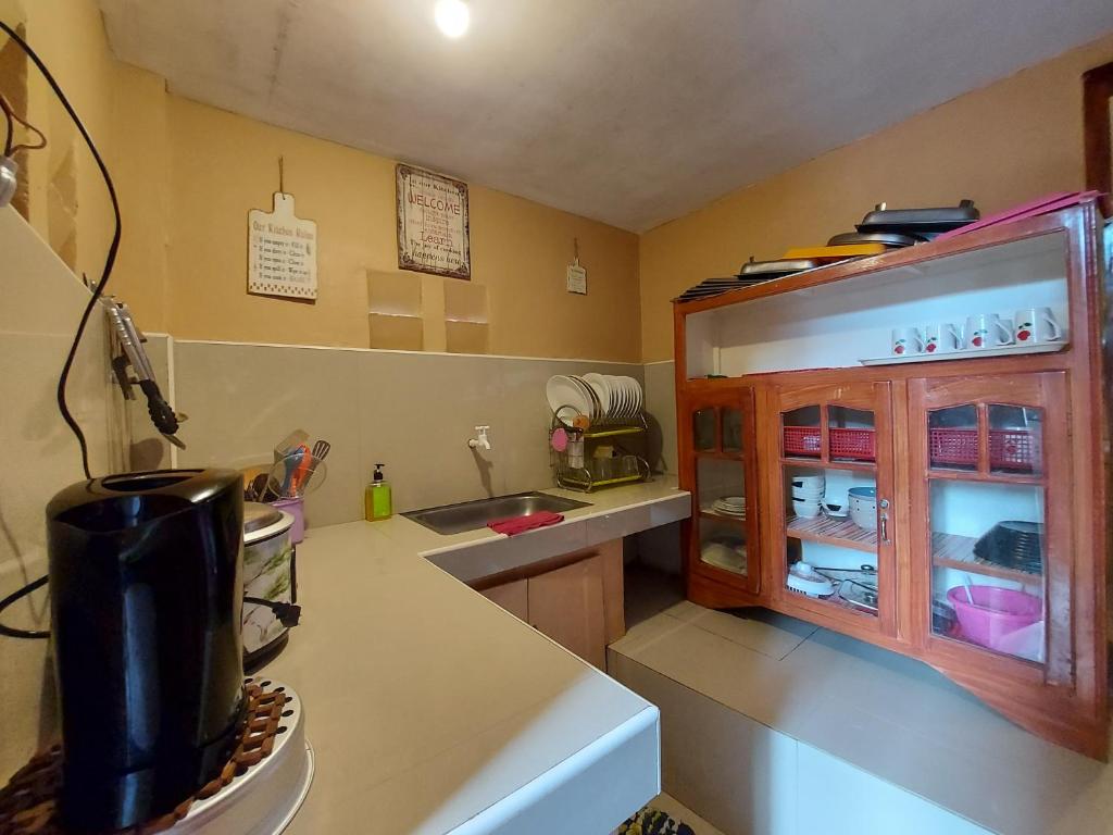 Kuchyň nebo kuchyňský kout v ubytování Dahilayan Comfy Cabin