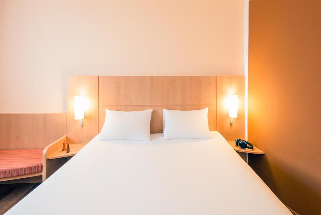 Postel nebo postele na pokoji v ubytování ibis Esch Belval