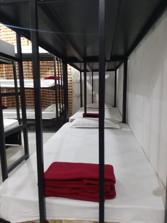 Letto o letti in una camera di KyGo Hostels