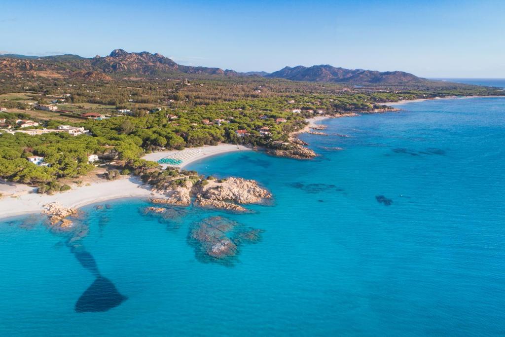 an aerial view of a beach in the ocean at Tirreno Resort in Cala Liberotto
