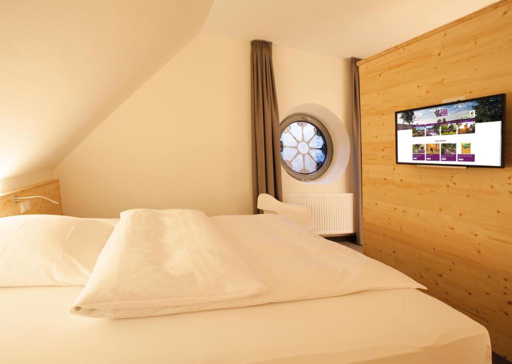 Postel nebo postele na pokoji v ubytování Hotel & Landgasthof Hoheluft