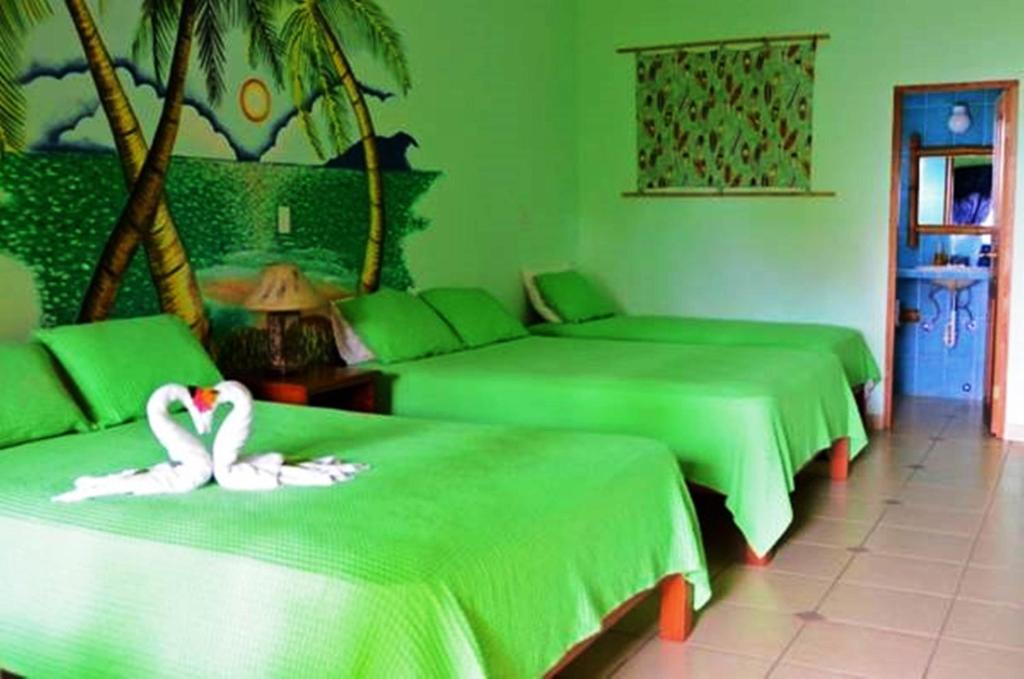 Postel nebo postele na pokoji v ubytování Las Lajas Beach Resort