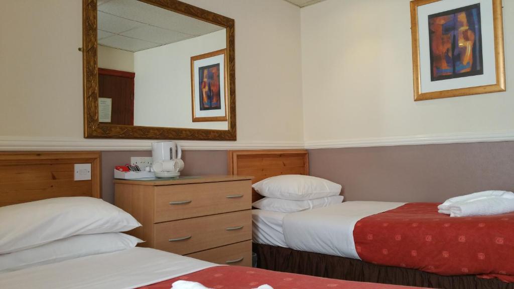 Кровать или кровати в номере Westholme Hotel