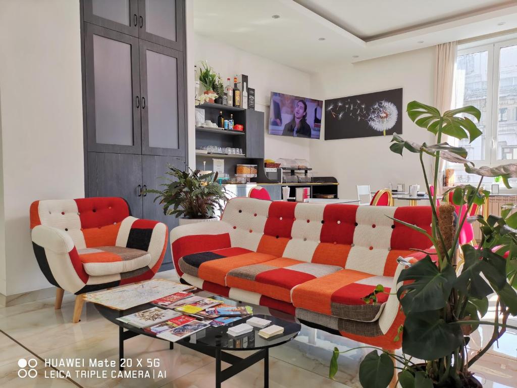 TV a/nebo společenská místnost v ubytování CSI Group - Hotel Metropoli
