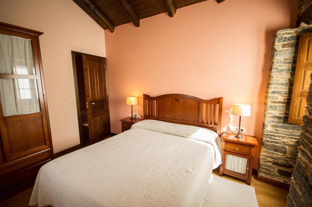 Postel nebo postele na pokoji v ubytování Apartamentos El Sualleiro