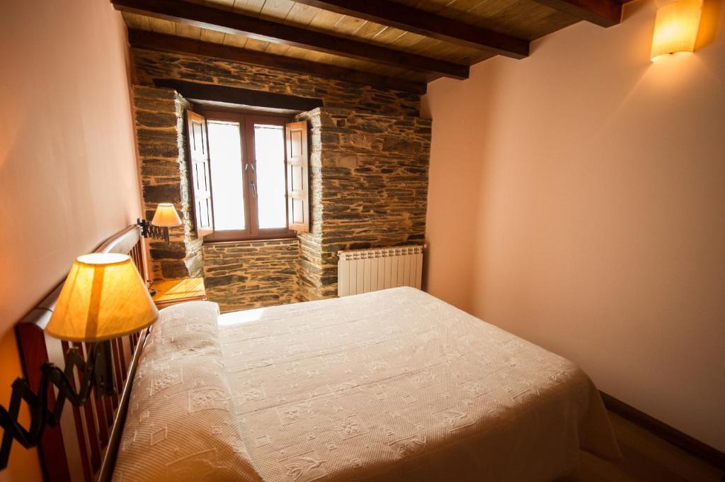 Postel nebo postele na pokoji v ubytování Apartamentos El Sualleiro