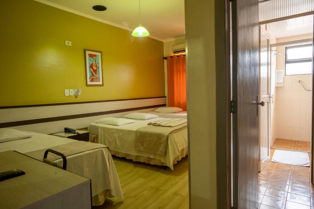 Postel nebo postele na pokoji v ubytování Seibt Palace Hotel
