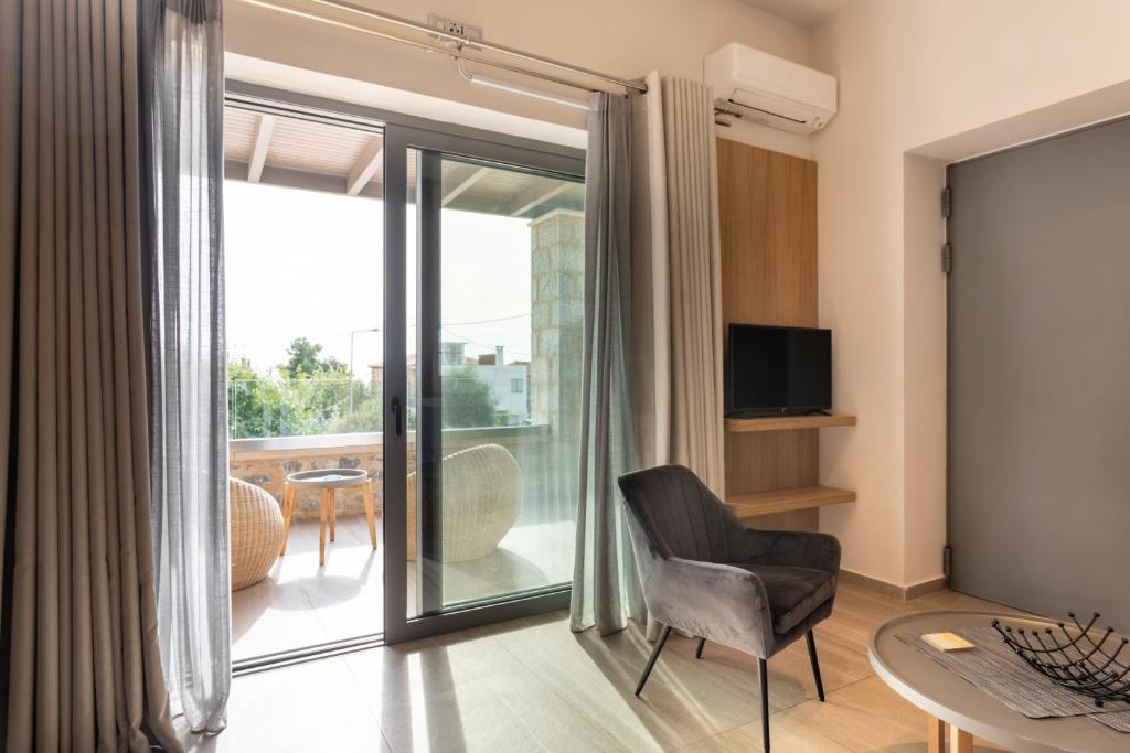 Televízia a/alebo spoločenská miestnosť v ubytovaní Linari Villas