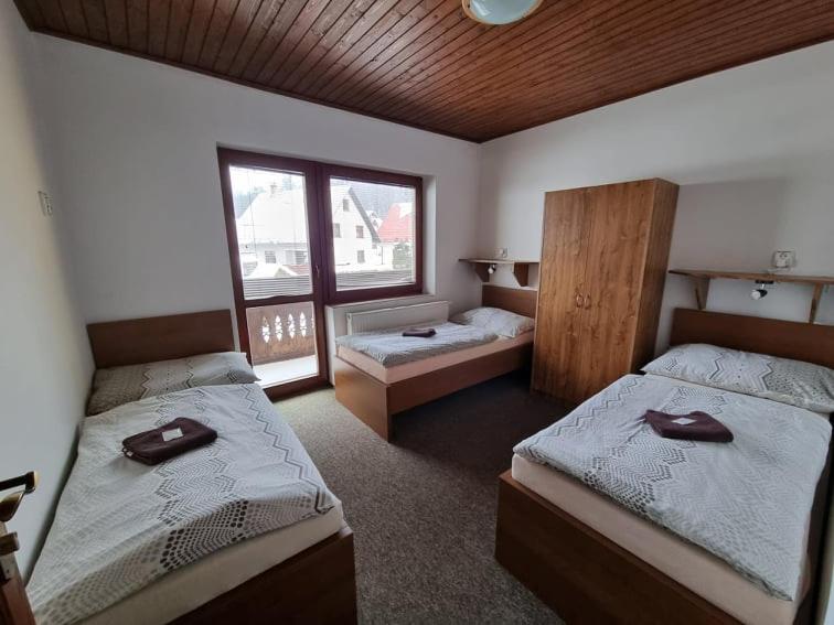 Posteľ alebo postele v izbe v ubytovaní Penzion Goral