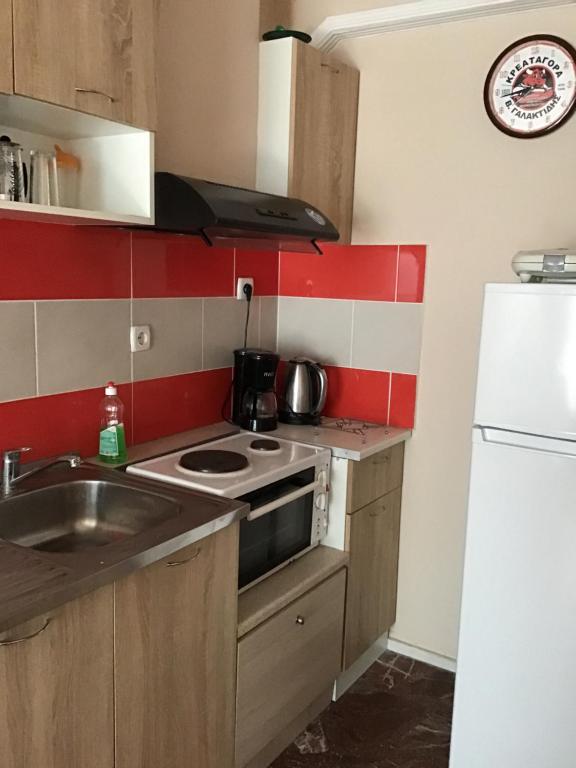 A kitchen or kitchenette at Ammos Apartments