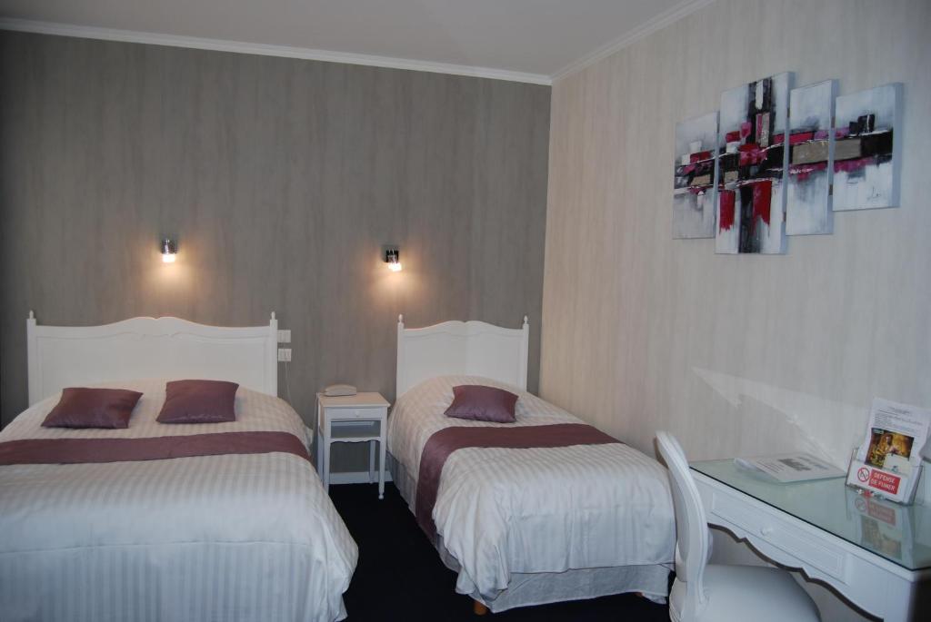 Postel nebo postele na pokoji v ubytování Hotel Biney