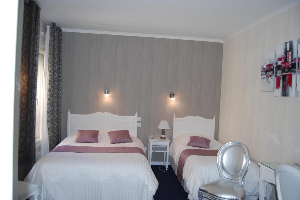 Postel nebo postele na pokoji v ubytování Hotel Biney