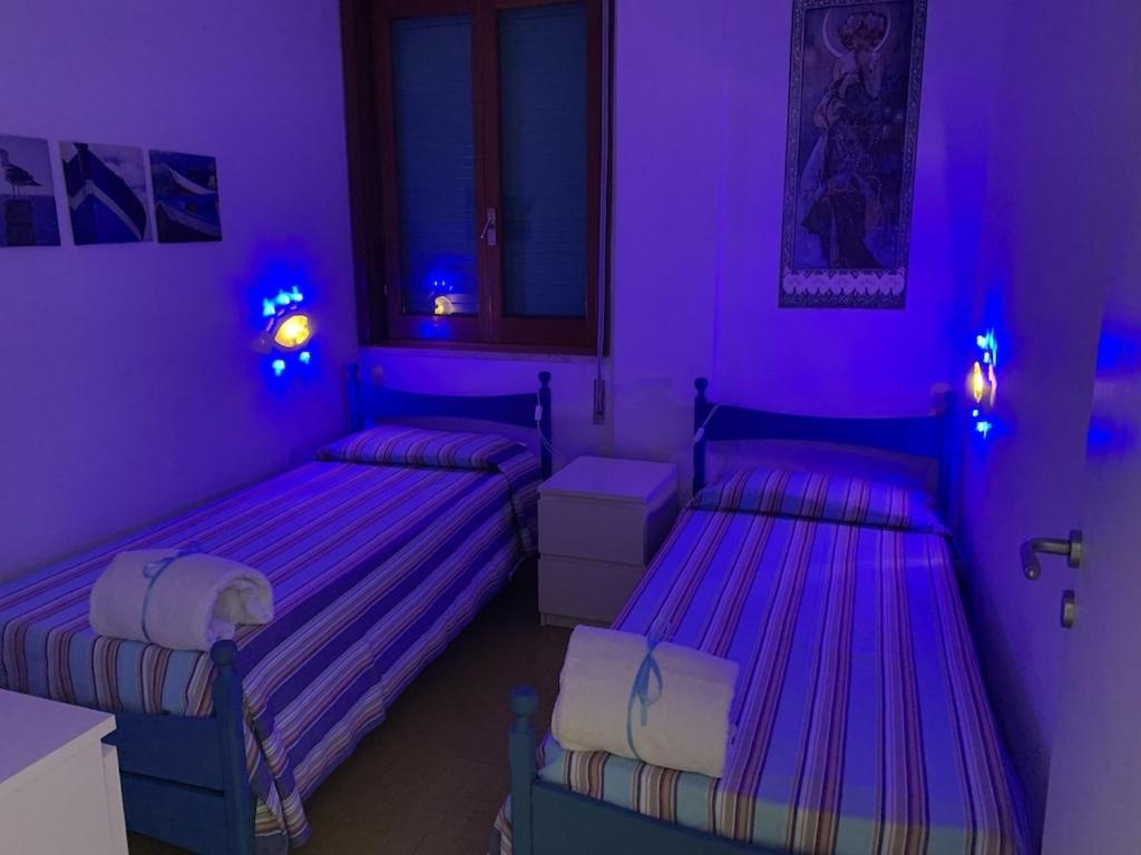Posteľ alebo postele v izbe v ubytovaní Casa delle dune