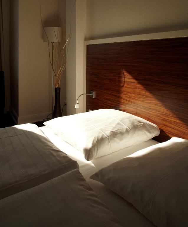 Postel nebo postele na pokoji v ubytování Hotel Excellent