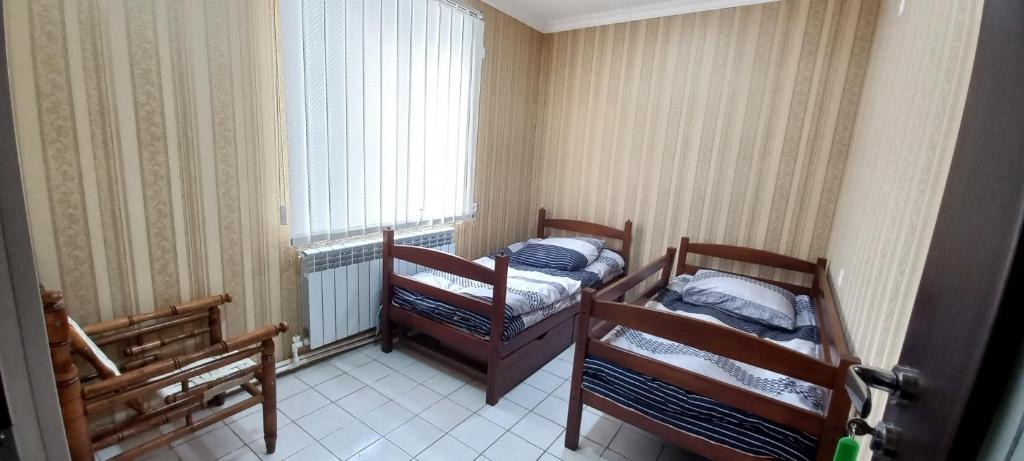Postel nebo postele na pokoji v ubytování Dream House & Hostel