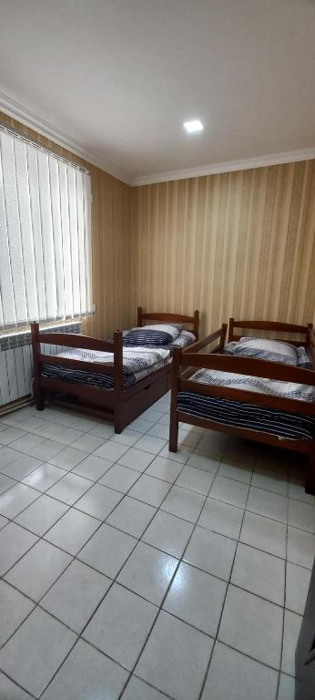 Postel nebo postele na pokoji v ubytování Dream House & Hostel