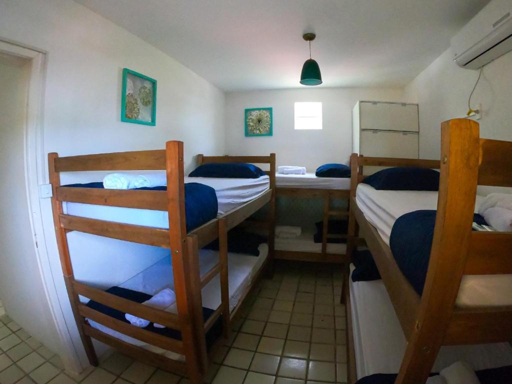 Postel nebo postele na pokoji v ubytování Porto Paraiso Hostel