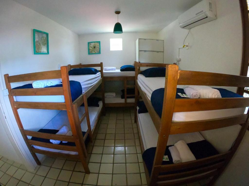 Postel nebo postele na pokoji v ubytování Porto Paraiso Hostel
