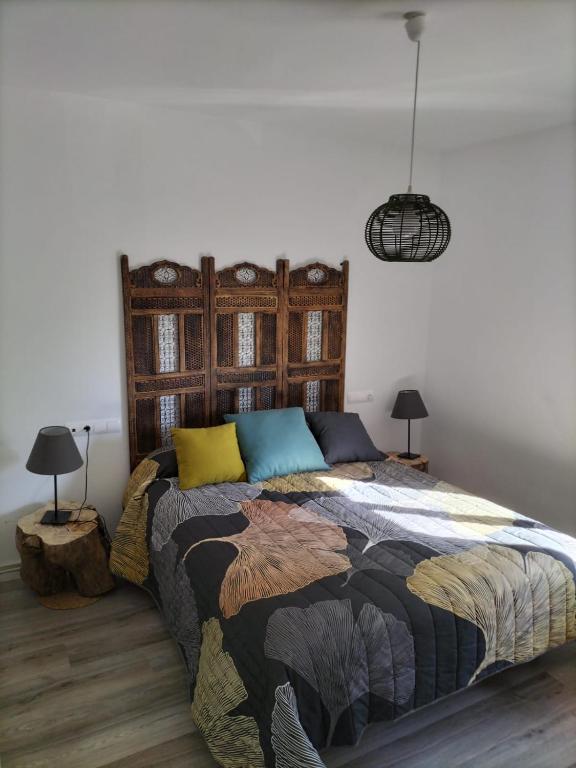 Posteľ alebo postele v izbe v ubytovaní Puerta Laguna - Casa con parcela