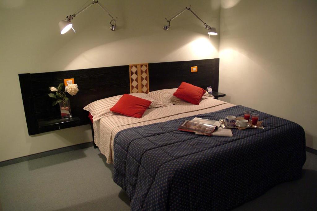 Postel nebo postele na pokoji v ubytování Hotel Orvieto