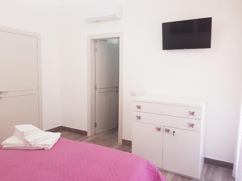 Łóżko lub łóżka w pokoju w obiekcie B&B Del Corso