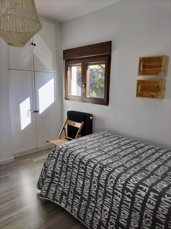 Posteľ alebo postele v izbe v ubytovaní Puerta Laguna - Casa con parcela