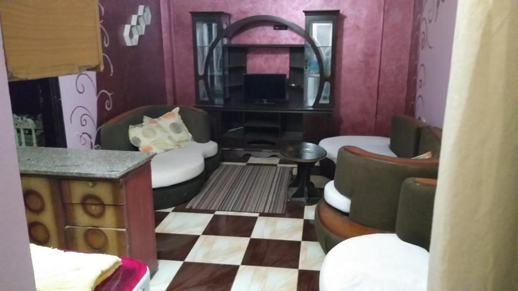 A seating area at App11- BELAL - Enjoy the privacy of staying in a quiet apartment with free Wi-Fi as your complete second home in the heart of Hurghada