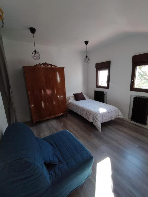 Posteľ alebo postele v izbe v ubytovaní Puerta Laguna - Casa con parcela