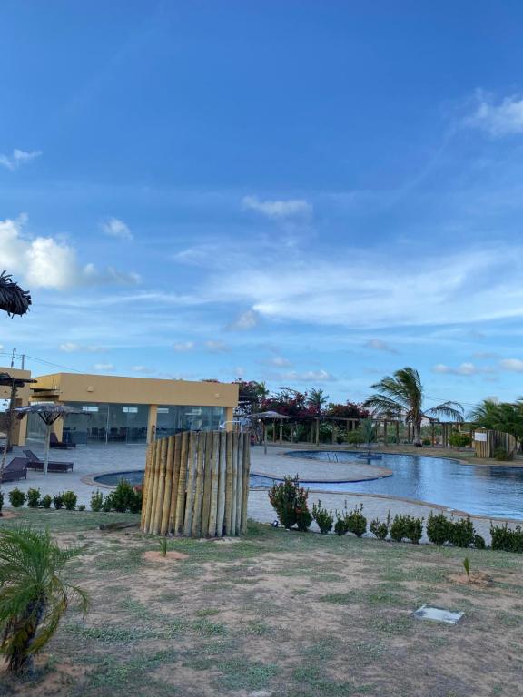 a view of a building with a body of water at Santo Mar Em São Miguel do gostoso in Touros