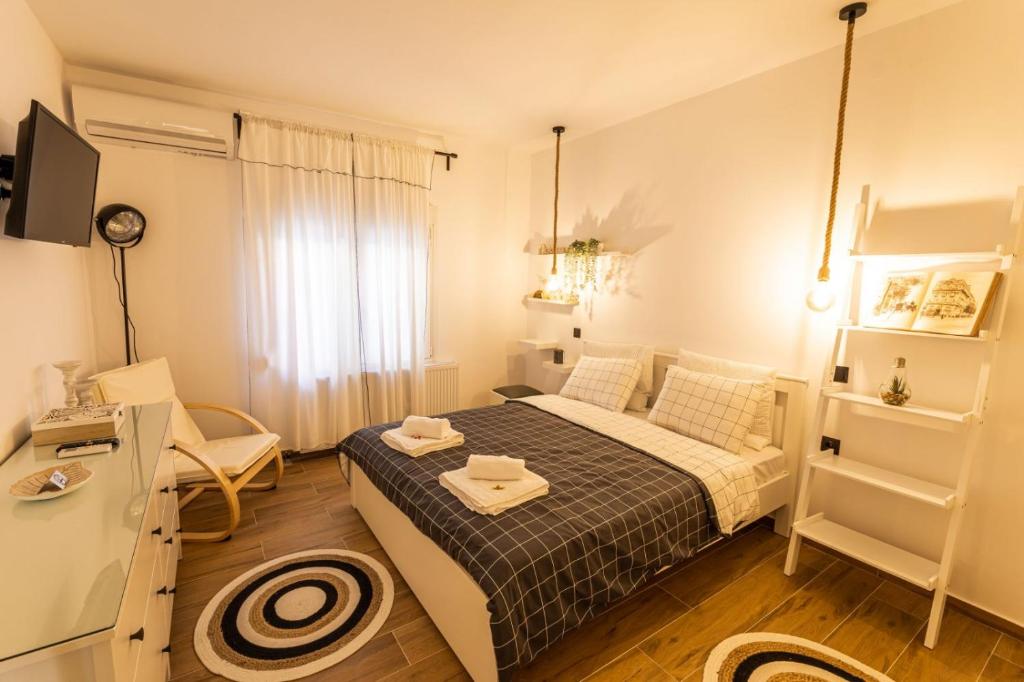 Giường trong phòng chung tại Welcome Home Meteora - Kalampaka!