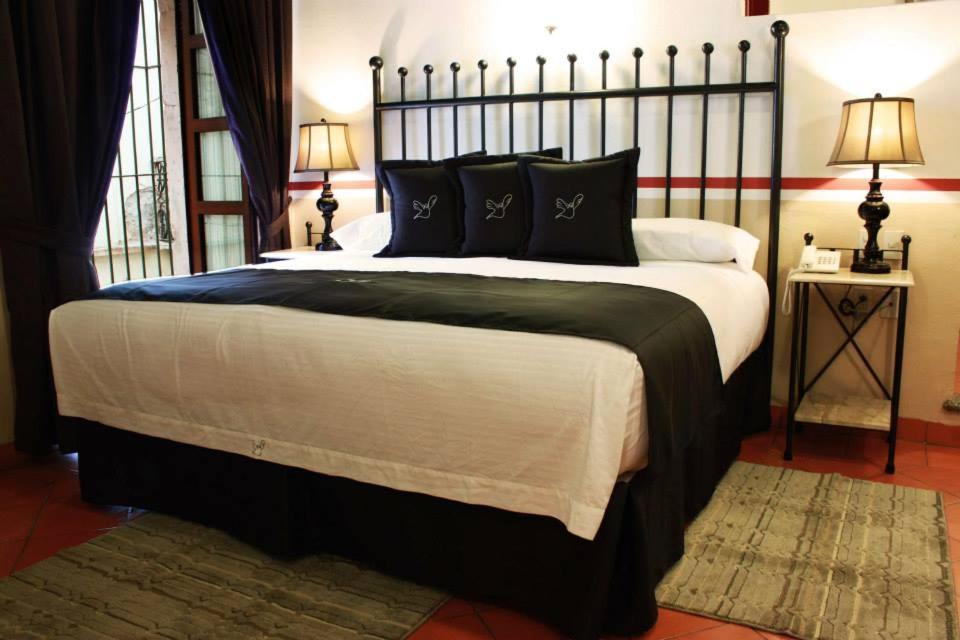 Postel nebo postele na pokoji v ubytování Hotel de la Paz