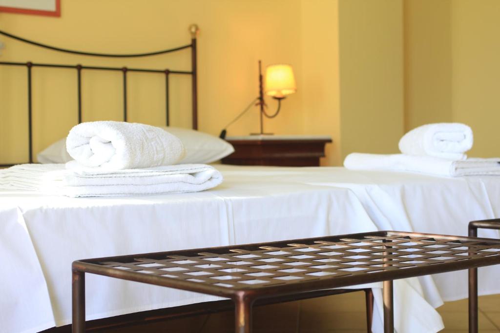 A bed or beds in a room at iliobasilema studios & apartments