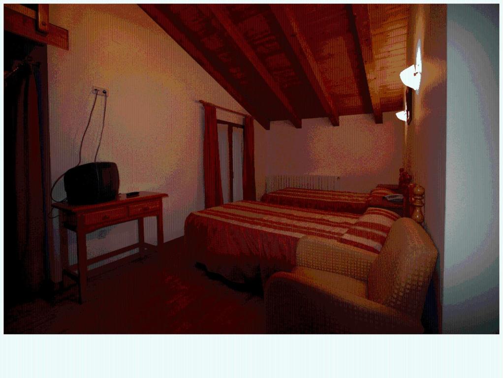 Postel nebo postele na pokoji v ubytování Hotel Can Mestre