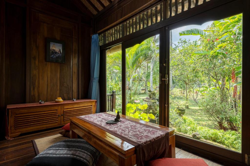 Postel nebo postele na pokoji v ubytování Alam Jiwa Ubud