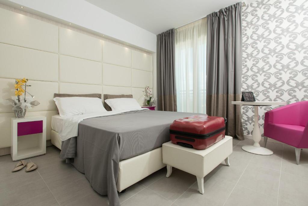 Postel nebo postele na pokoji v ubytování Hotel Sheila