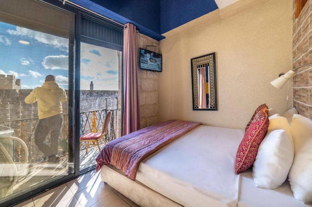 Postel nebo postele na pokoji v ubytování New Imperial Hotel