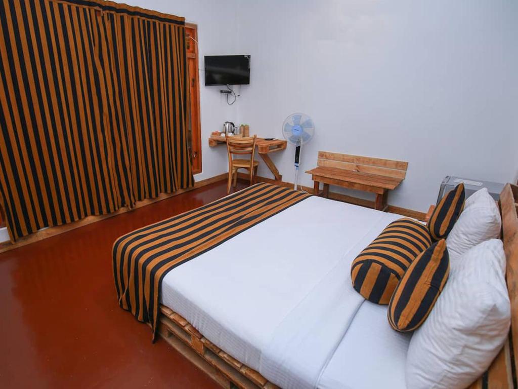 Postel nebo postele na pokoji v ubytování The Spice Lodge