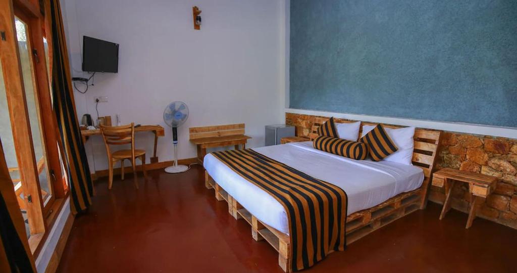 Postel nebo postele na pokoji v ubytování The Spice Lodge