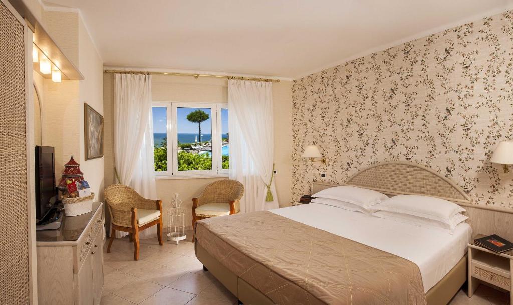 Postel nebo postele na pokoji v ubytování Hotel Posillipo