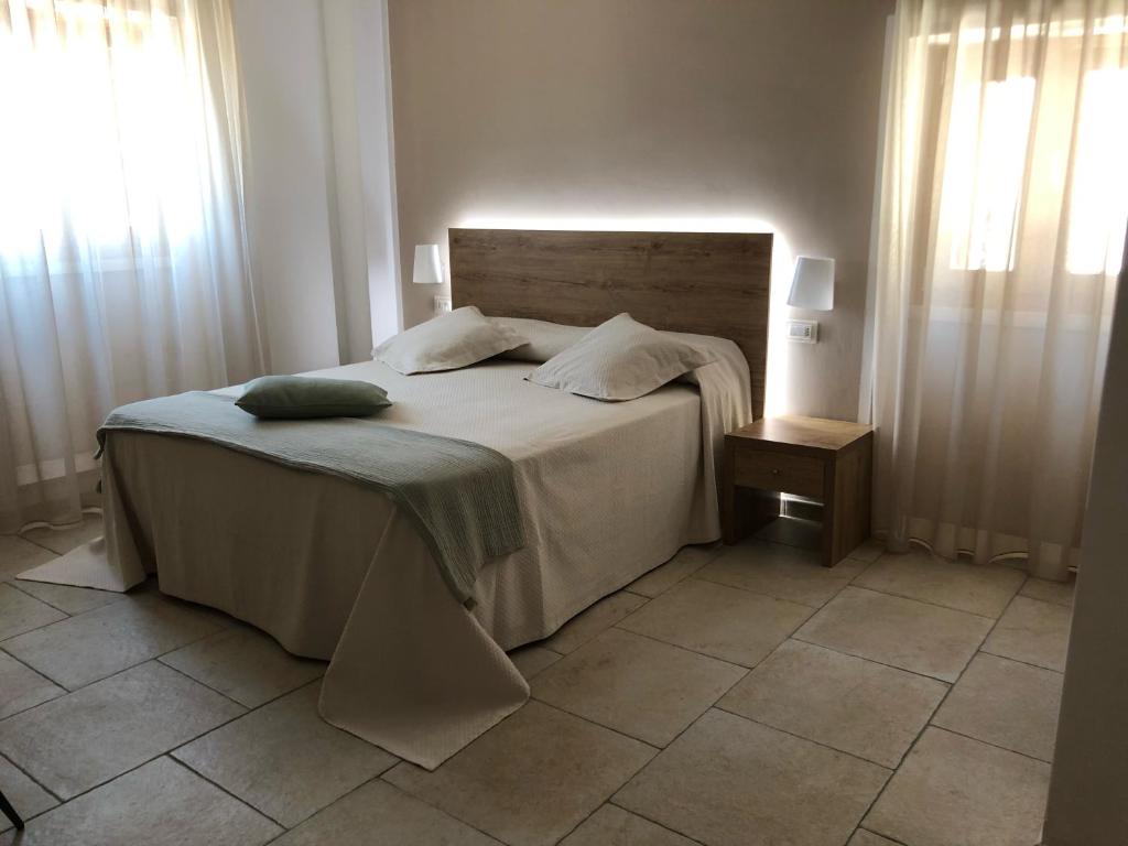 Postel nebo postele na pokoji v ubytování Hotel Punta San Francesco